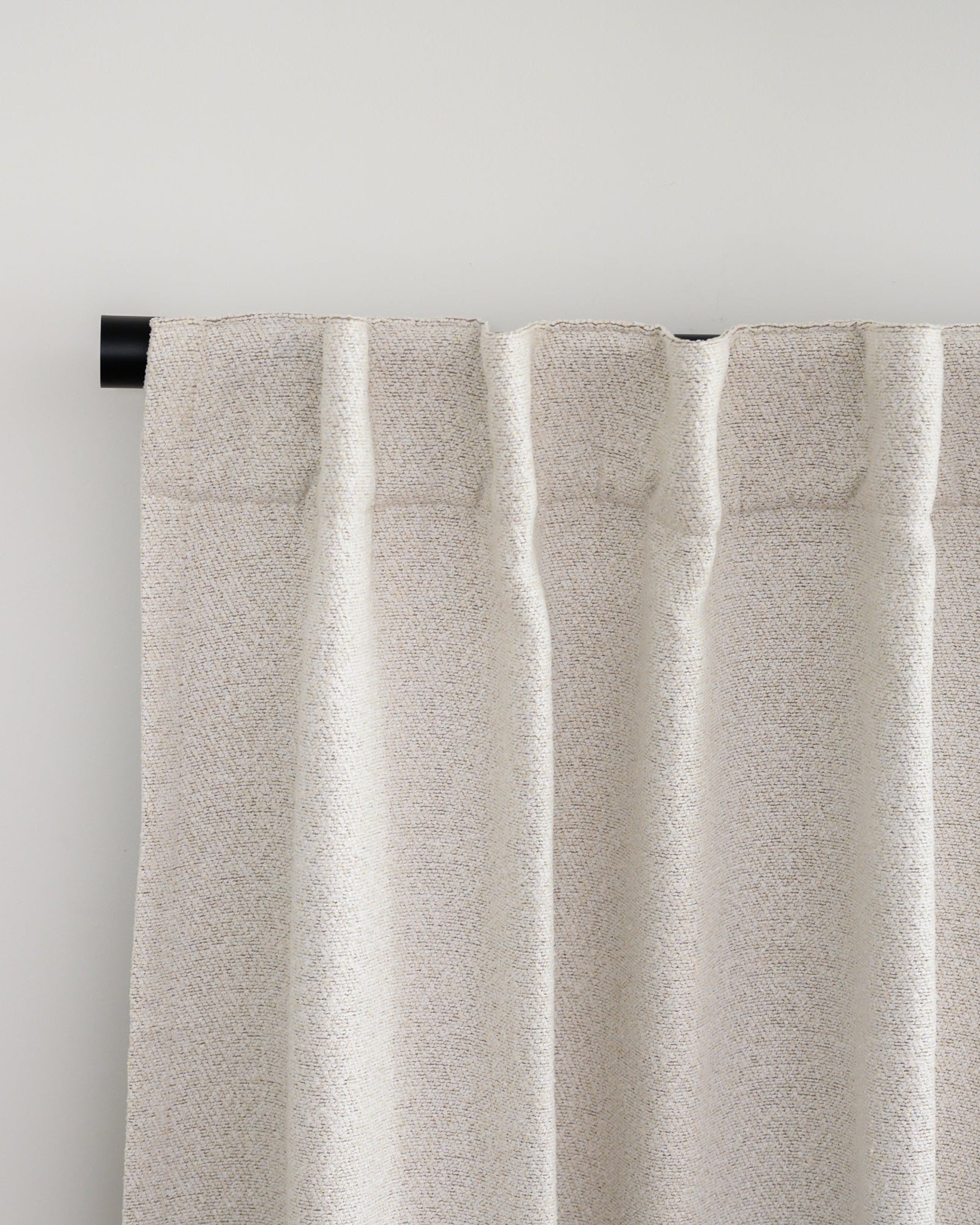 Brooklyn Boucle curtain with back tab header, styled in a relaxed pleat for a soft, designer finish.