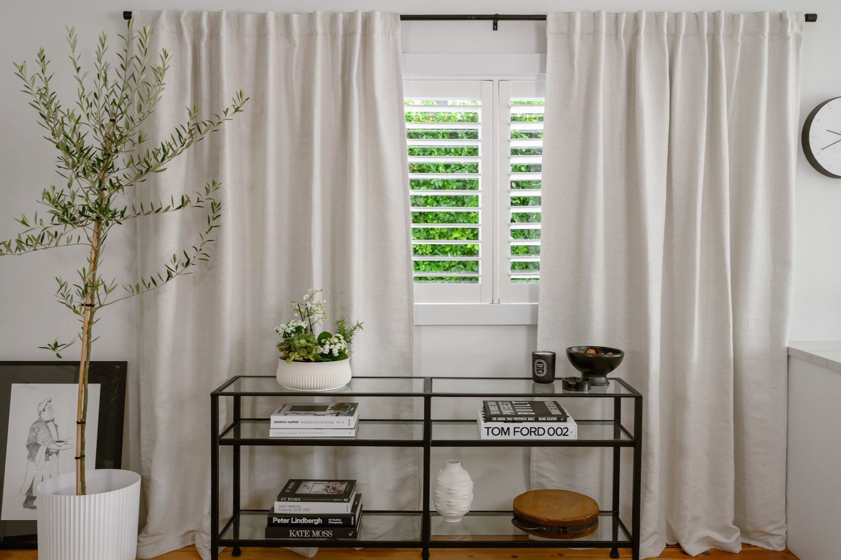 ChatGPT said:
Brooklyn bouclé curtains styled with a black console table for a modern, designer look.