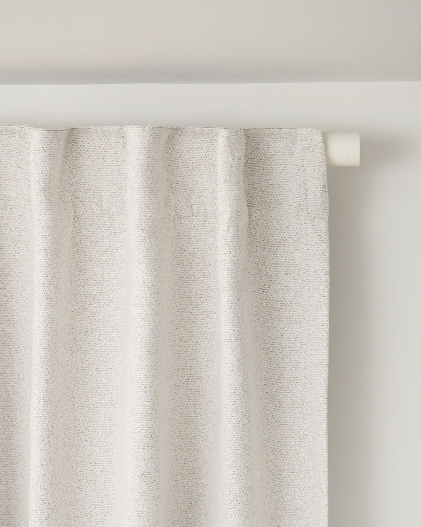Brooklyn Boucle curtain on the Rockford Rod in Soft White, demonstrating the back tab relaxed pleat for an effortless designer look.