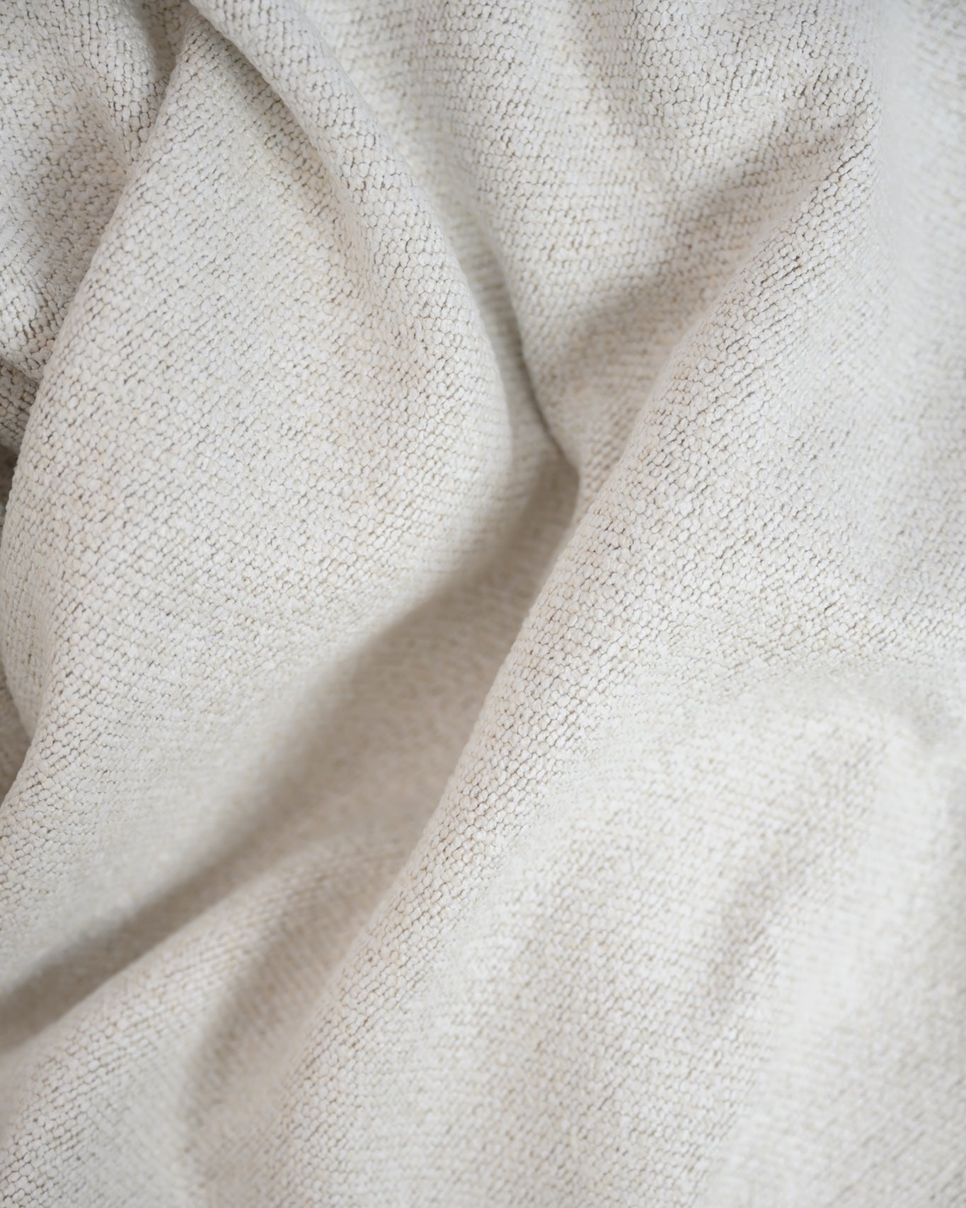 Close-up of the Brooklyn Bouclé fabric, highlighting its textured finish and timeless natural tone.