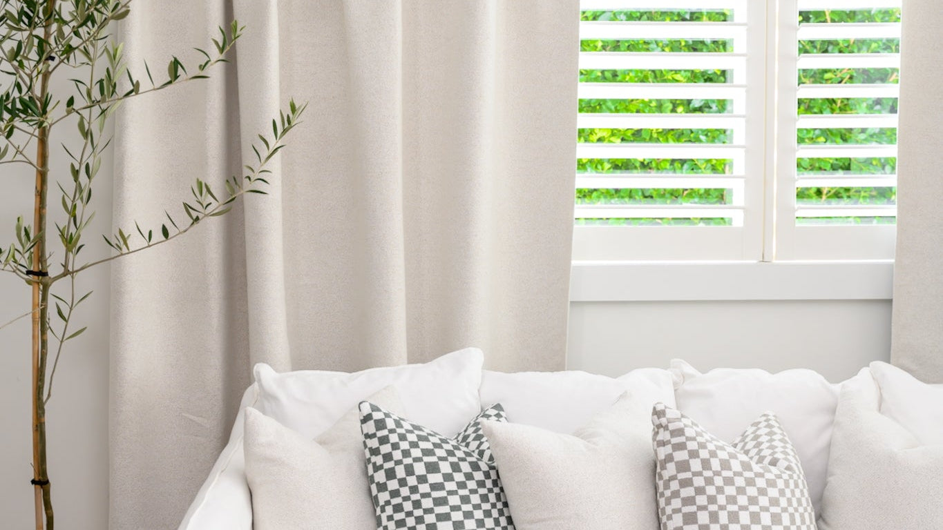 Neutral boucle curtain for living room, textured fabric for warmth and style.