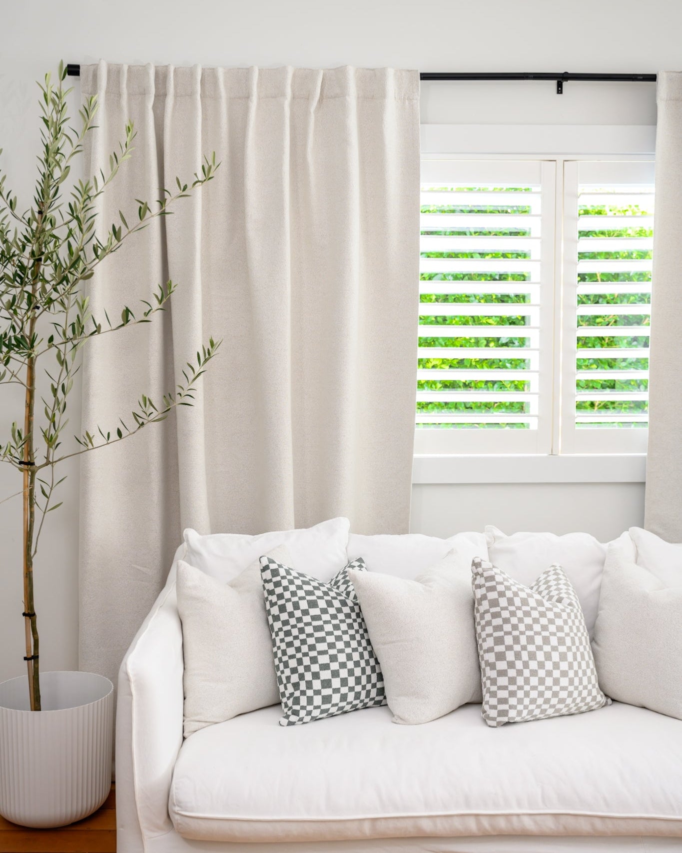 Neutral boucle curtain for living room, textured fabric for warmth and style.