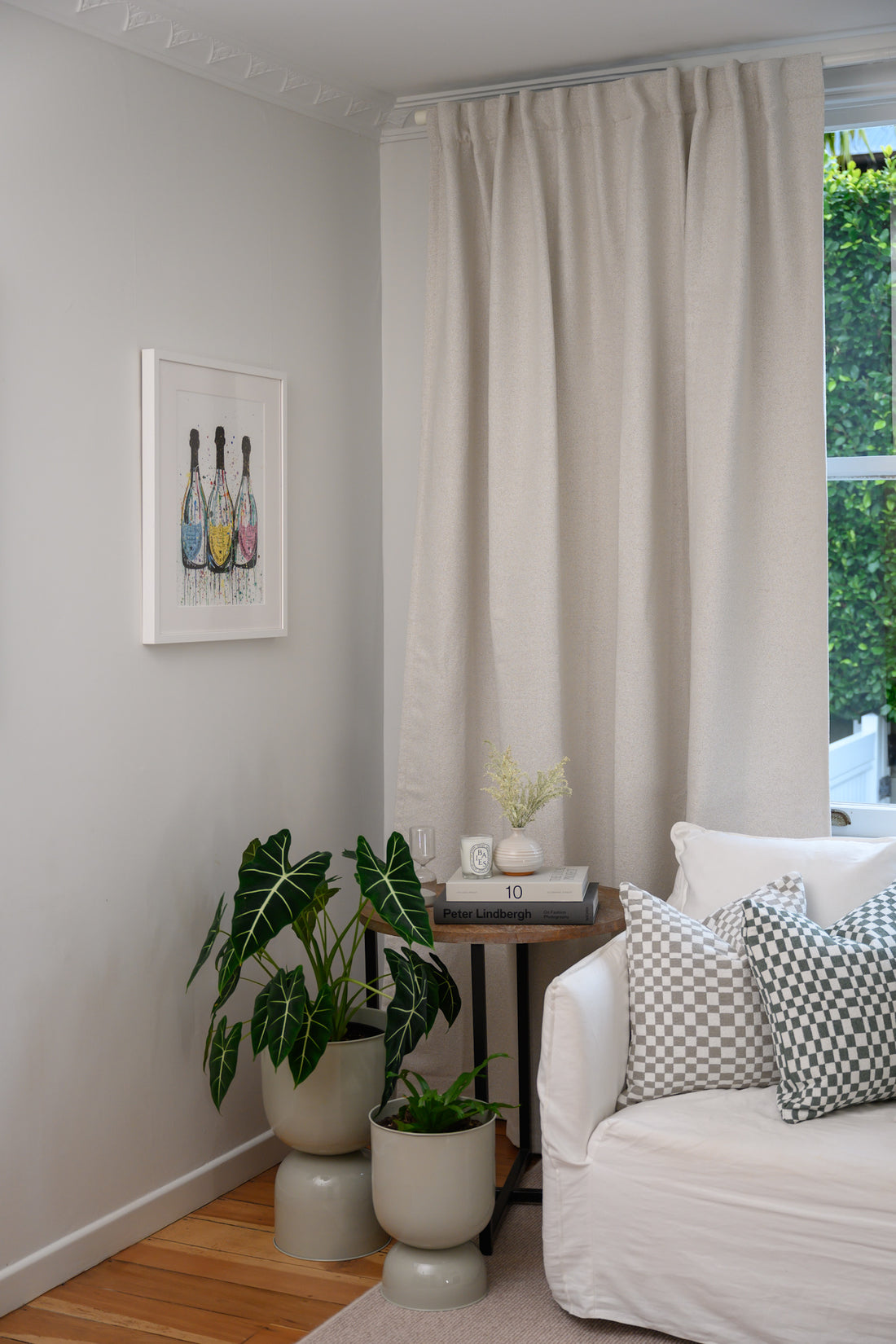 Chicago Check cushions in Sage and Dove Grey styled in a lounge with Brooklyn Boucle curtain for a cohesive designer look.