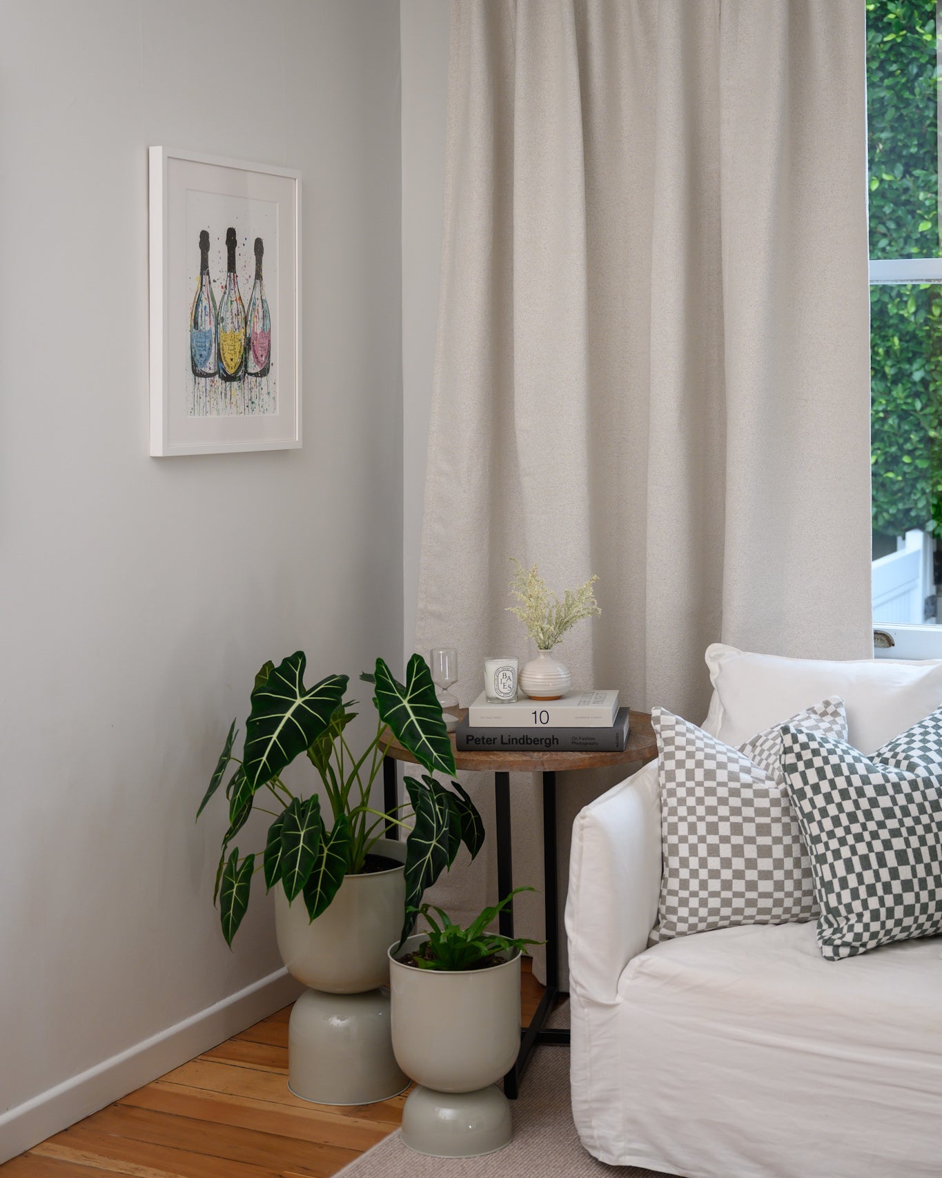 Chicago Check cushions in Sage and Dove Grey styled in a lounge with Brooklyn Boucle curtain for a cohesive designer look.