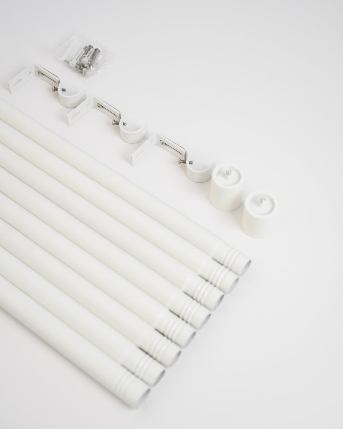 Unpacking the Rockford Rod in Soft White, with modular pieces that screw together for easy installation and compact, fast delivery.