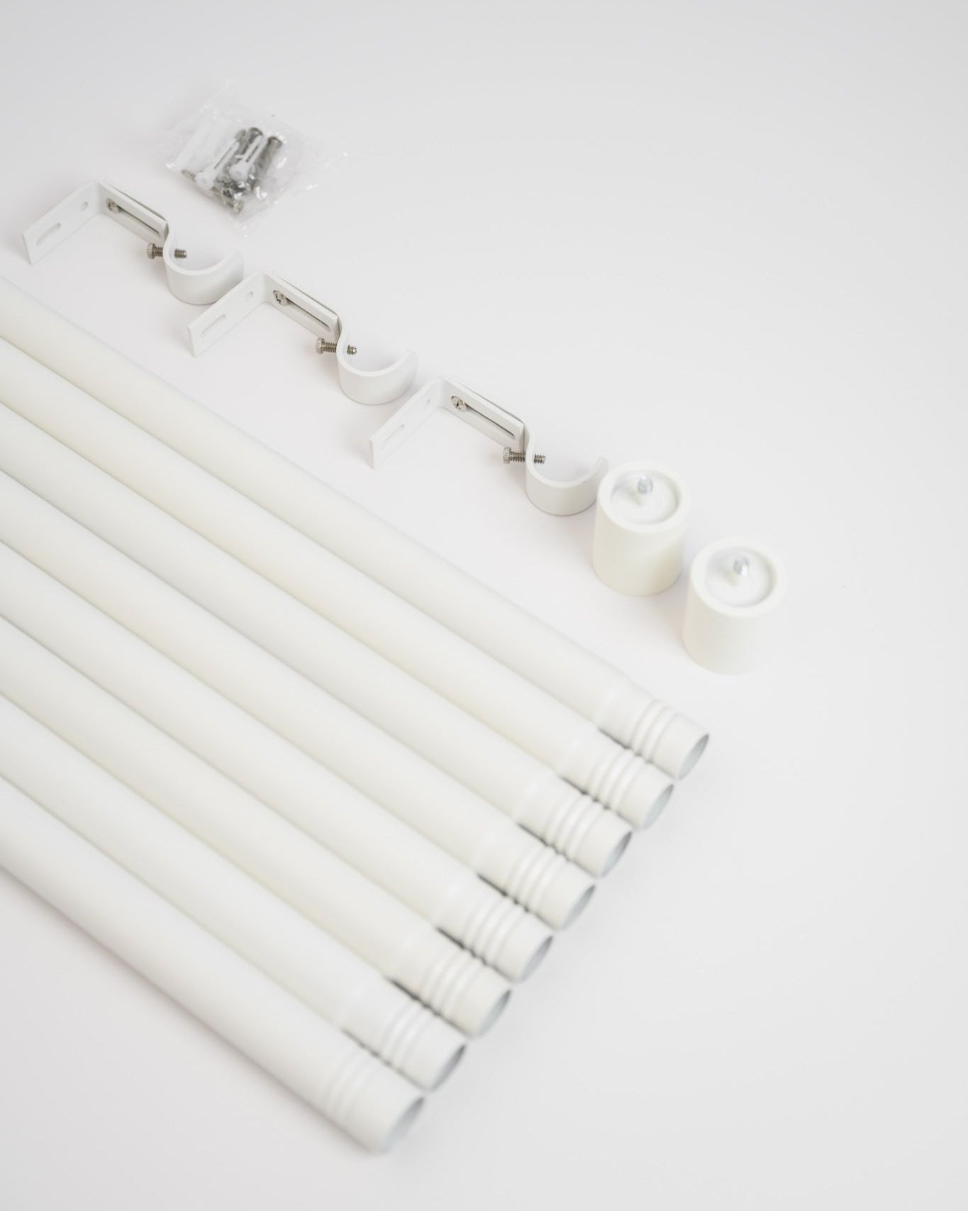 Unpacking the Rockford Rod in Soft White, with modular pieces that screw together for easy installation and compact, fast delivery.