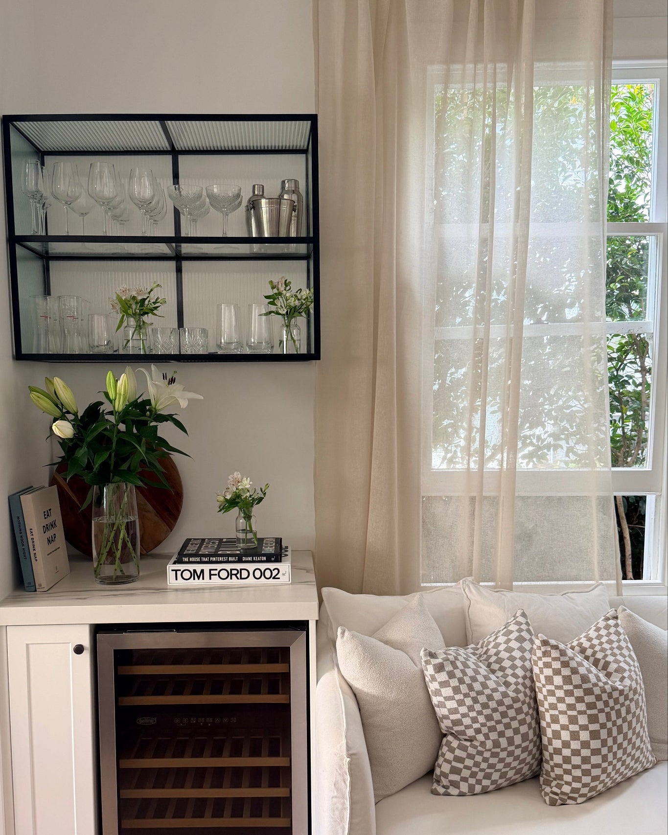 Soho Sheer curtain in Natural linen blend, softly filtering light in a modern lounge with neutral furnishings.