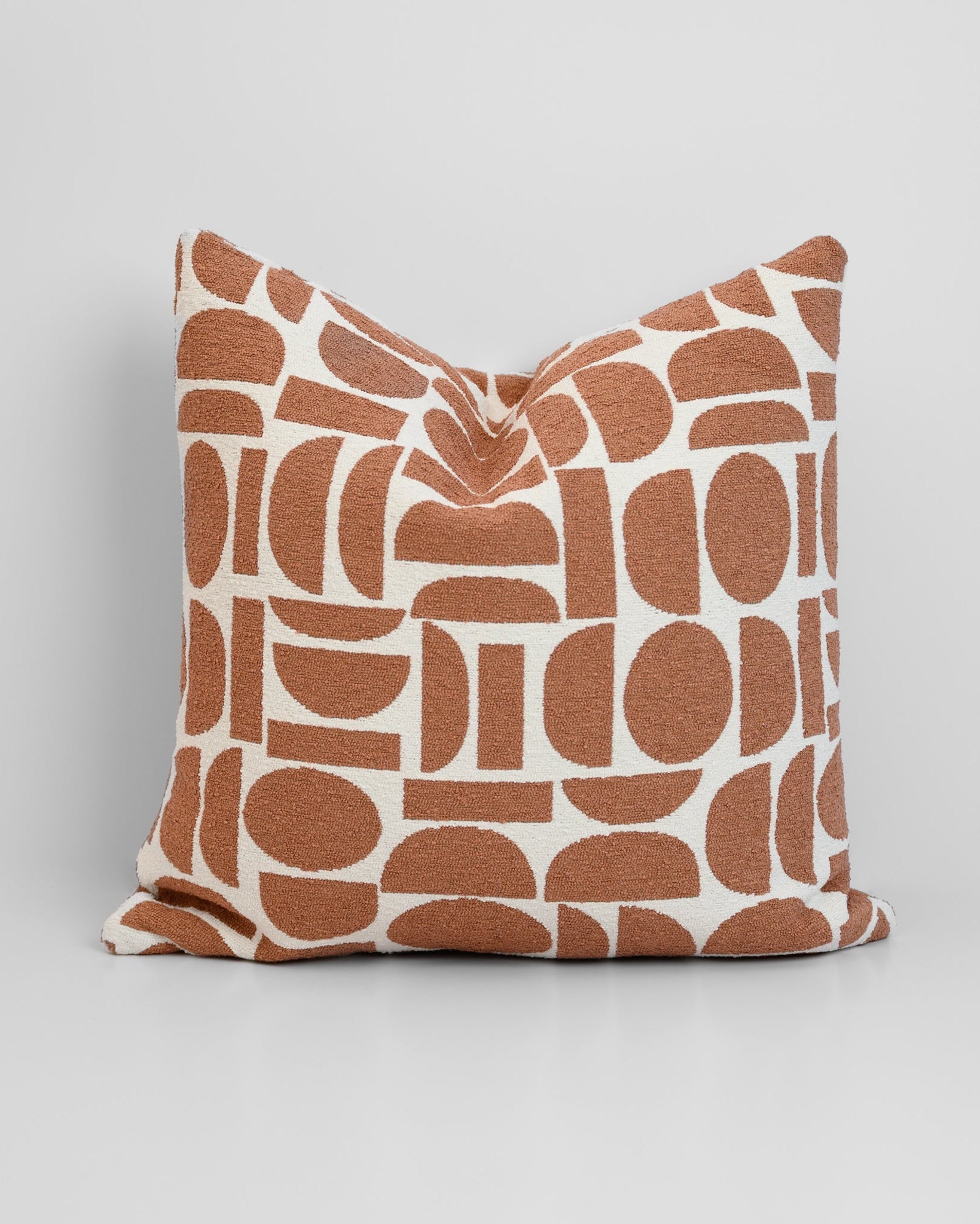Chelsea Crescent Cushion in Terracotta with boucle texture and geometric design, styled for a chic, modern finish.