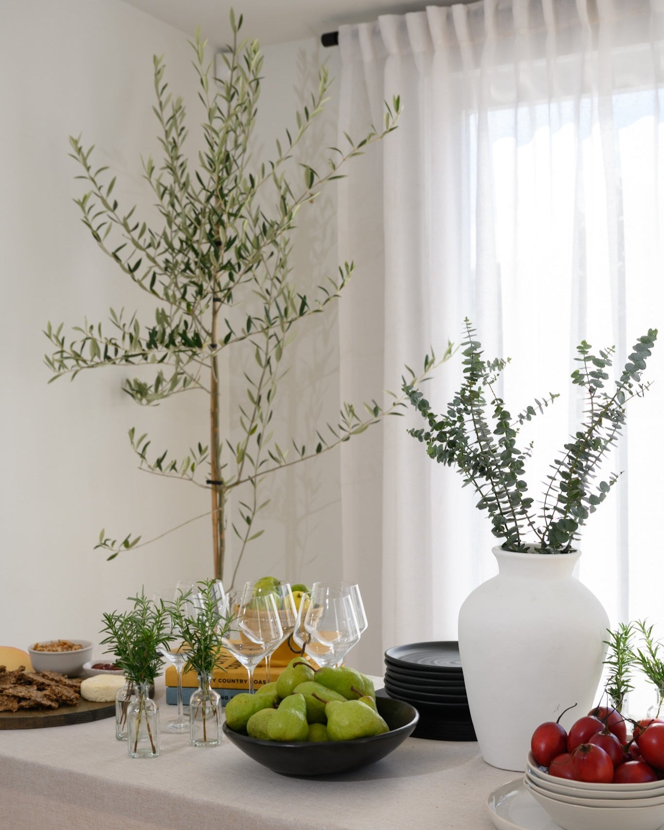 The Soho Sheer curtains styled in a dining room with a chic, modern table setting — the perfect backdrop for relaxed, stylish entertaining.