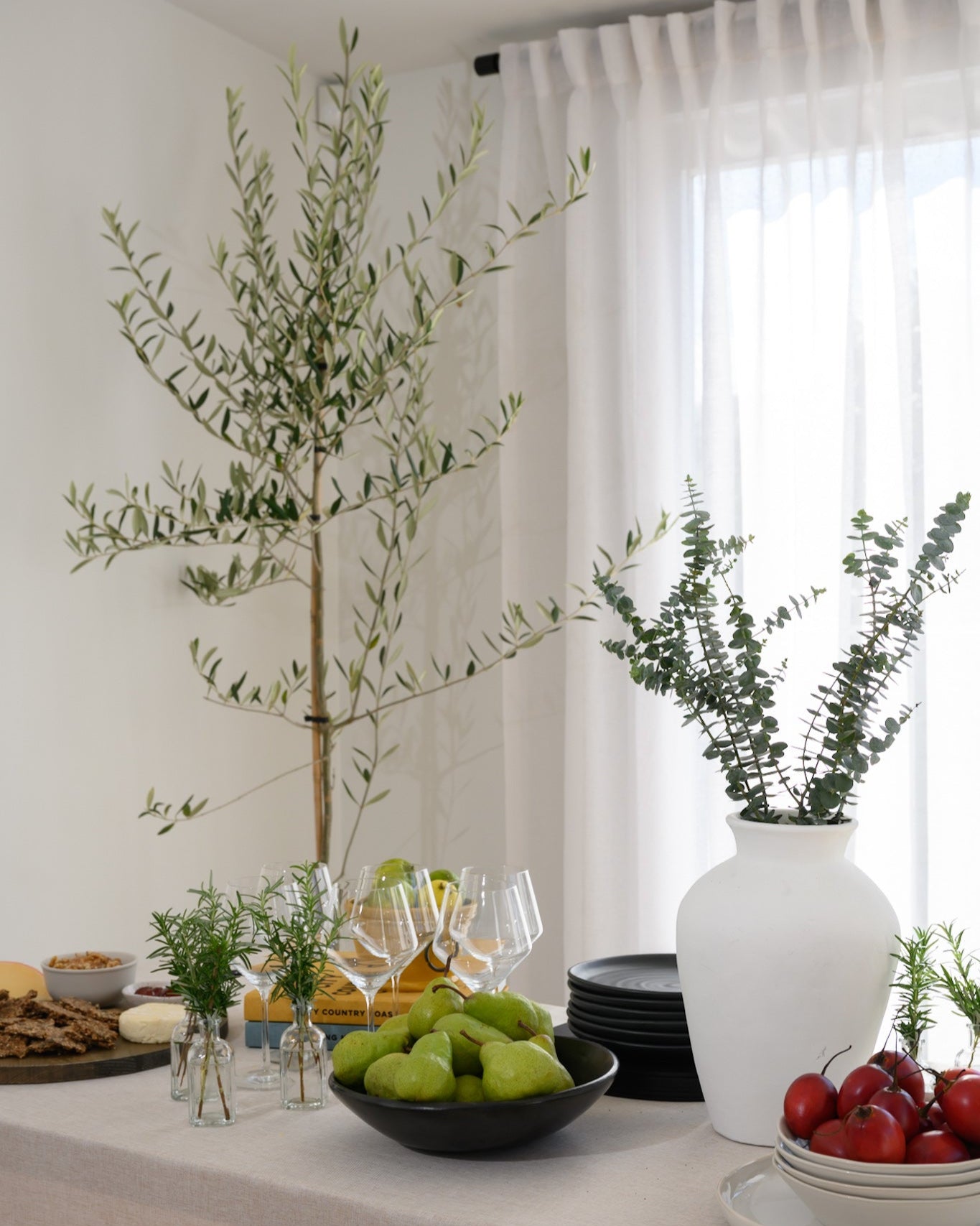 The Soho Sheer curtains styled in a dining room with a chic, modern table setting — the perfect backdrop for relaxed, stylish entertaining.