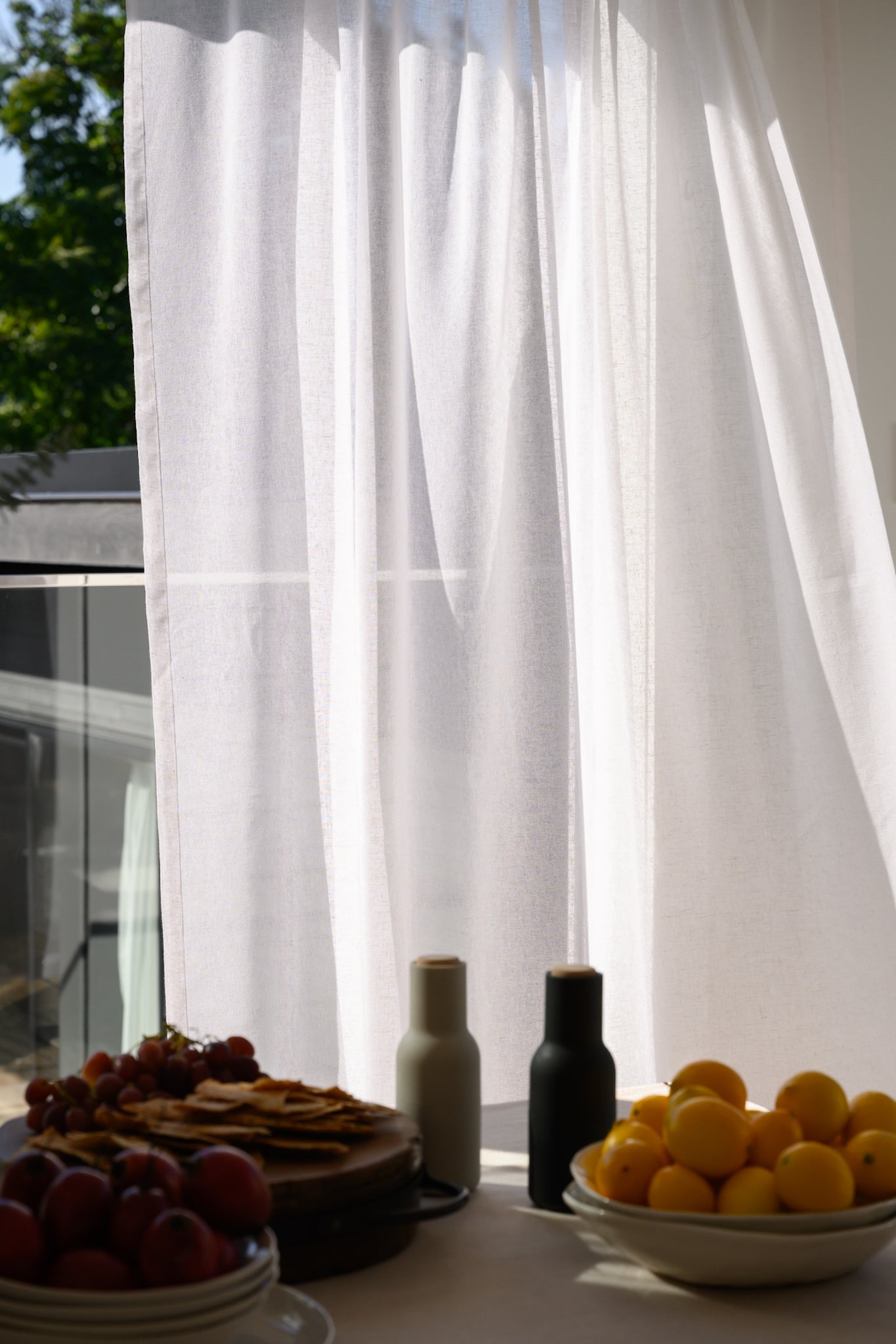 Soho Sheer curtains styled in a dining room for an effortless, Pinterest-worthy look.