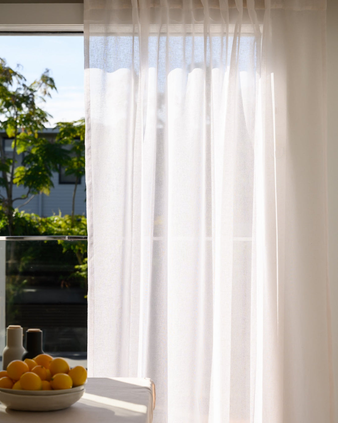 Soho Sheer curtains styled in a dining room for an effortless, Pinterest-worthy look.