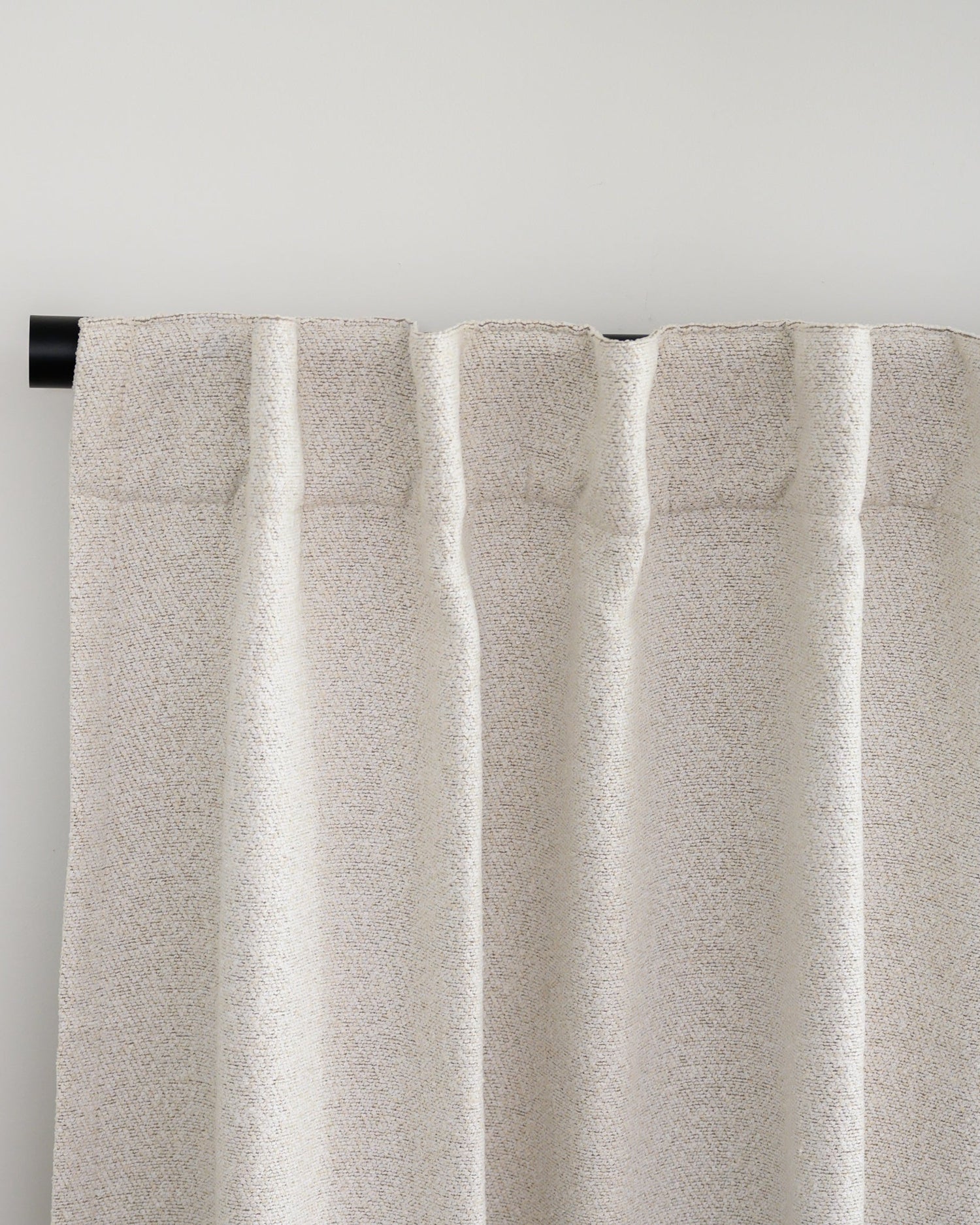 Brooklyn Boucle curtain with back tab header, styled in a relaxed pleat for a soft, designer finish.