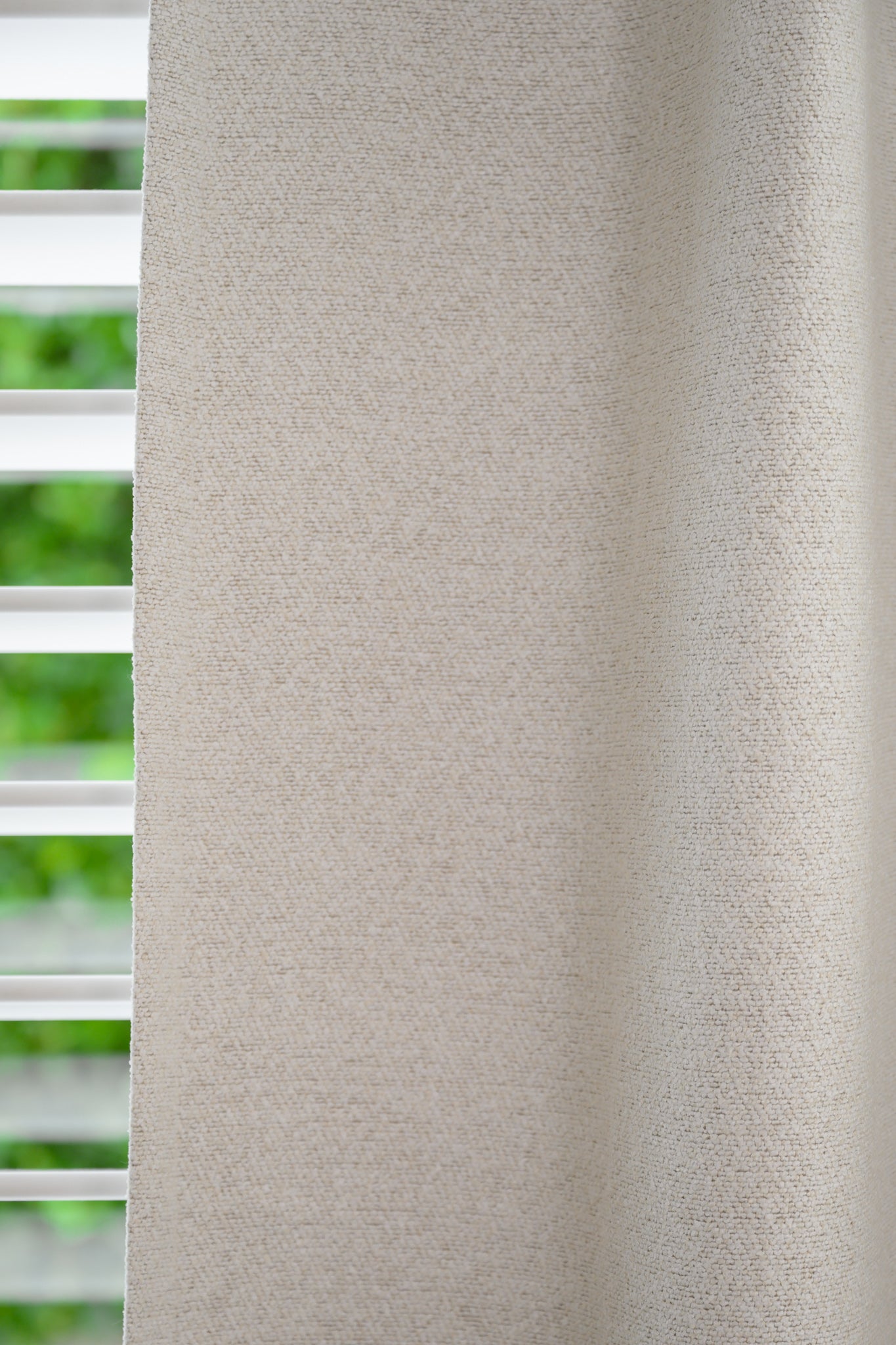 Detailed view of Brooklyn Boucle fabric, highlighting the thick, textured weave and soft neutral tone.