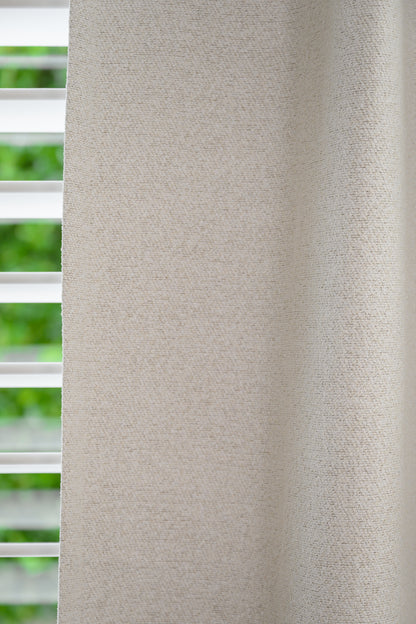 Detailed view of Brooklyn Boucle fabric, highlighting the thick, textured weave and soft neutral tone.