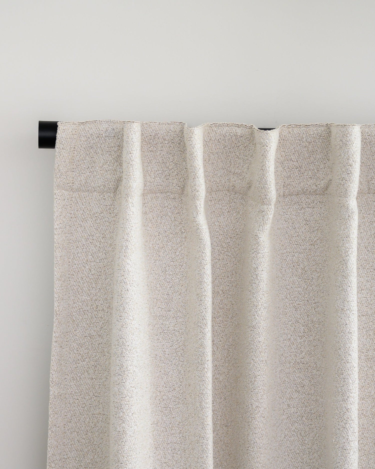 Brooklyn Boucle curtain with back tab header, styled in a relaxed pleat for a soft, designer finish.