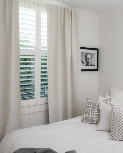 Brooklyn boucle curtain in bedroom, room-darkening fabric for warmth and style.