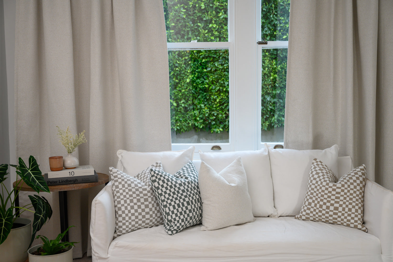 Brooklyn bouclé curtains with white couch and Chicago Check cushions for a modern, textured living room look.