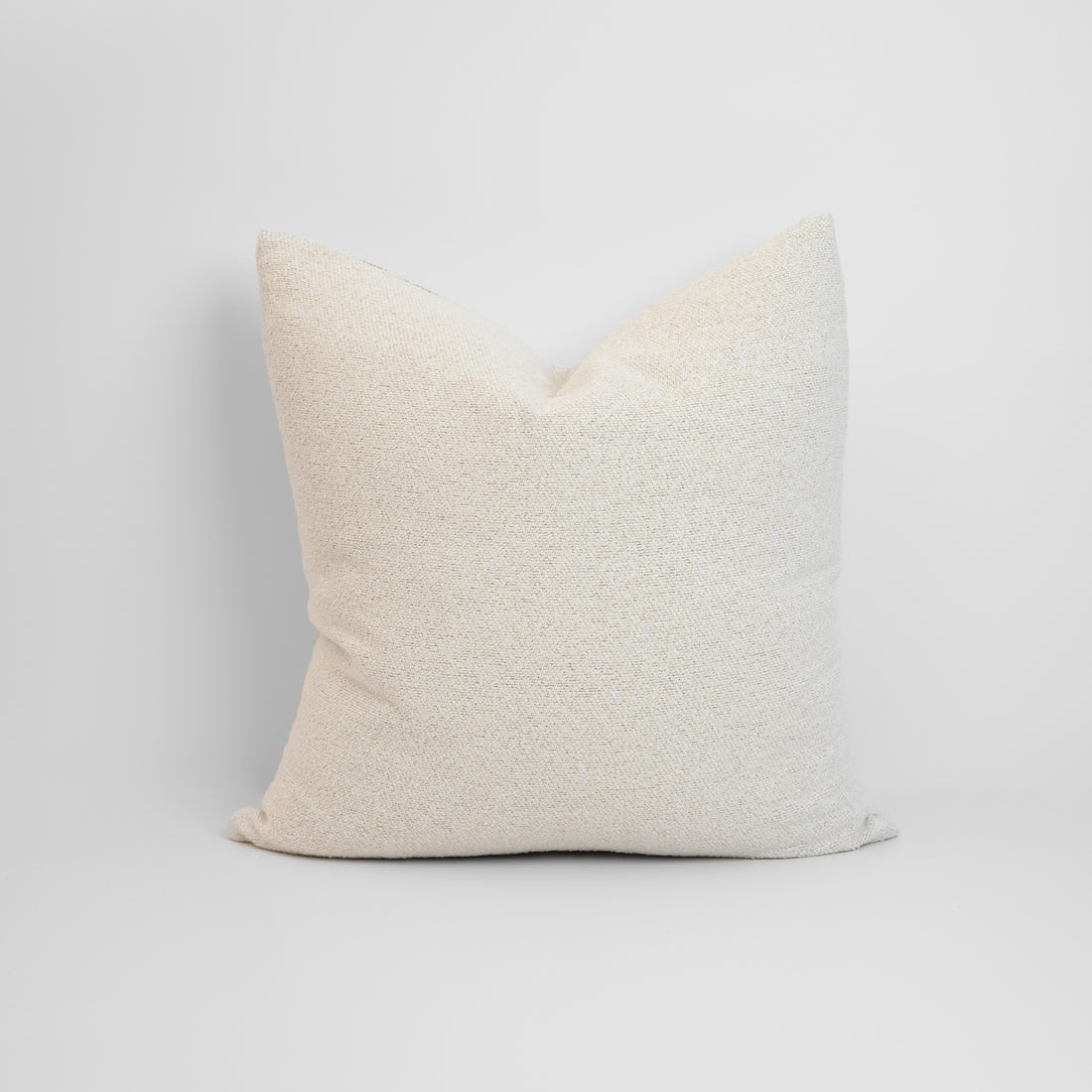 Brooklyn Boucle Cushion with textured boucle fabric in a soft neutral tone, styled for a warm, modern finish.