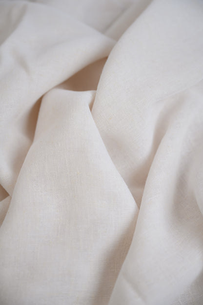 Close-up of Soho Linen fabric in Soft White, showing the beautiful texture and natural linen fibres for a soft, elegant finish.
