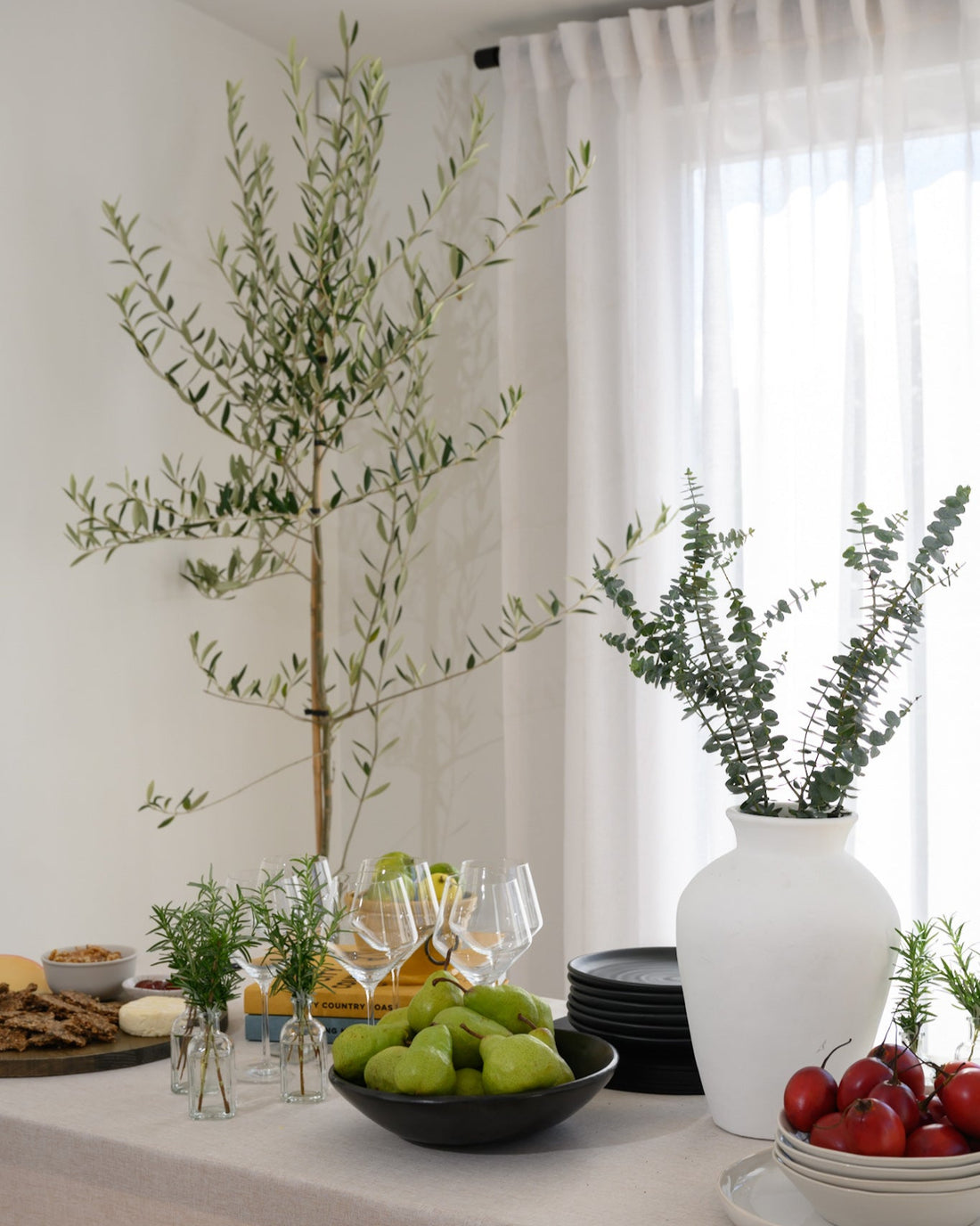 The Soho Sheer curtains styled in a dining room with a chic, modern table setting — the perfect backdrop for relaxed, stylish entertaining.