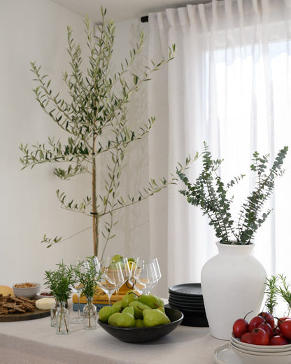 The Soho Sheer curtains styled in a dining room with a chic, modern table setting — the perfect backdrop for relaxed, stylish entertaining.